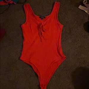 Red Small Body suit with short thin sleeves.